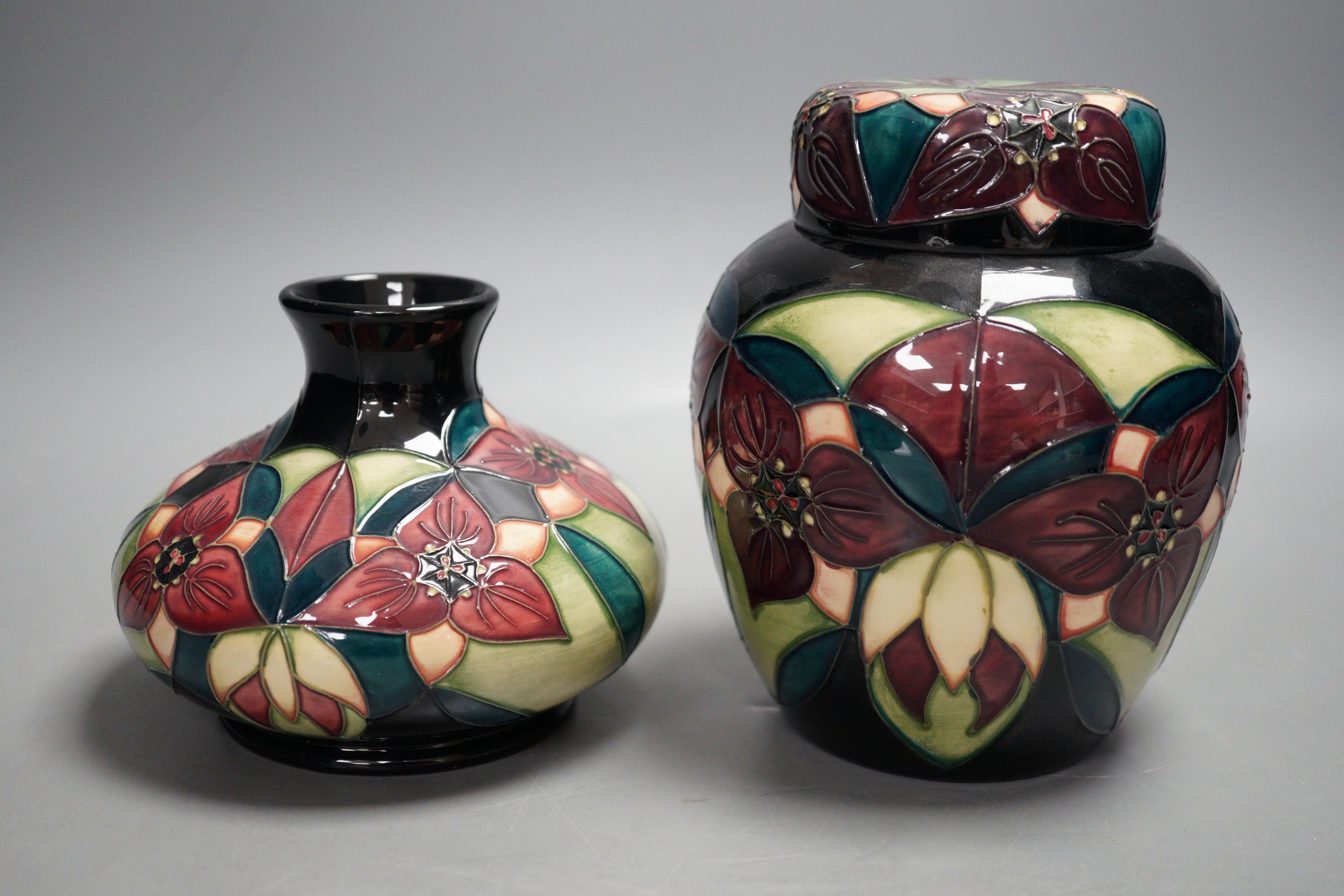 A Moorcroft pottery squat shaped vase and lidded ginger jar, decorated in the 